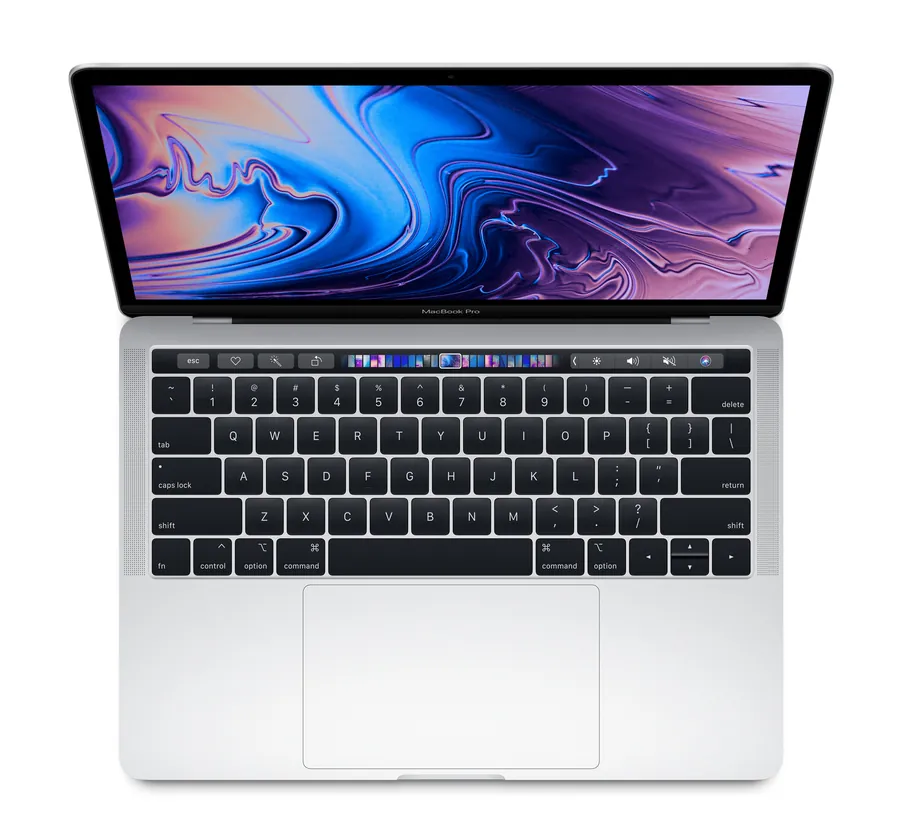 MacBook Pro seen from above with the Touch Bar lit